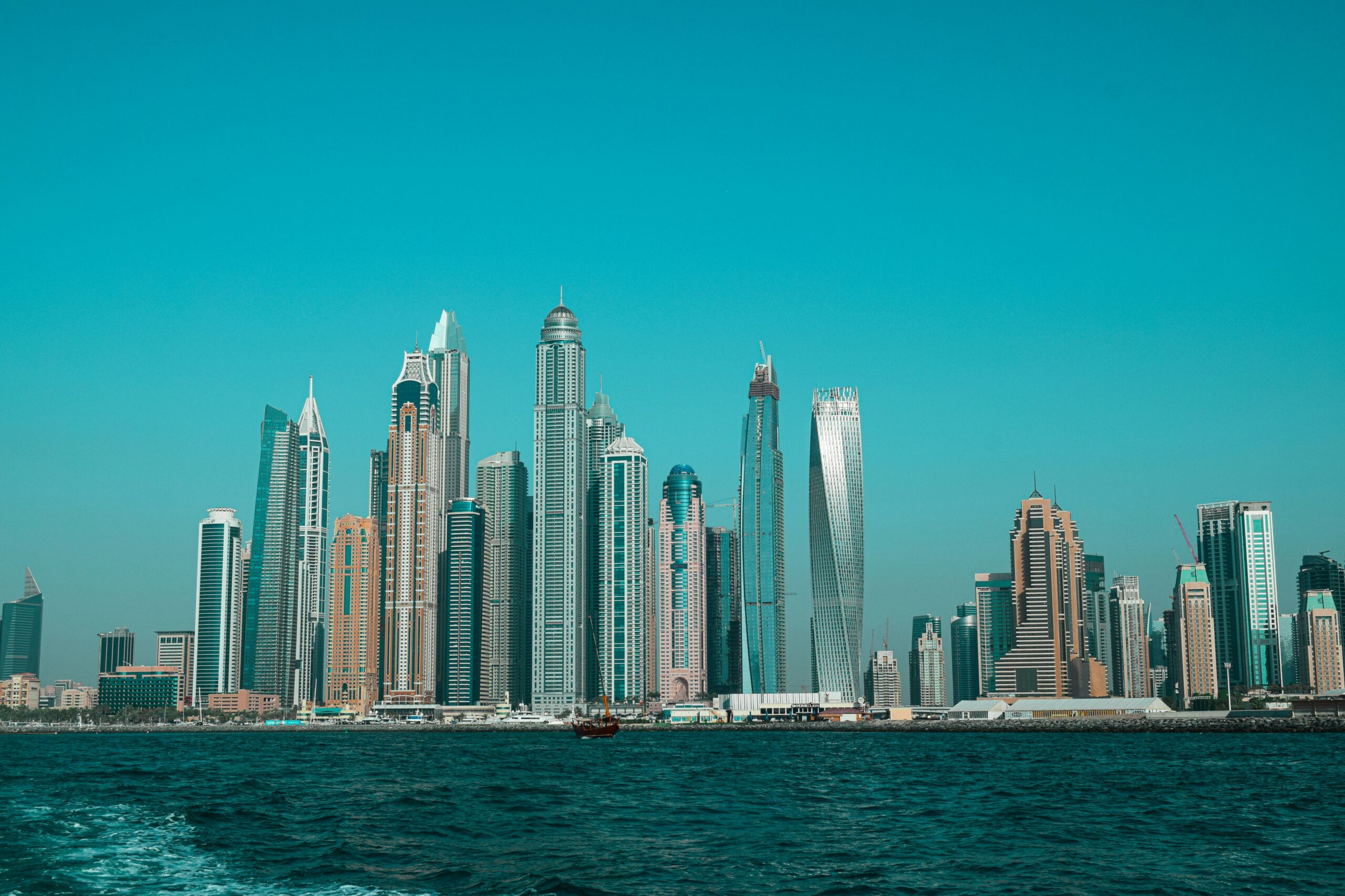 A buyer reviewing the steps of the Dubai property purchase process with documents, a checklist, and a cityscape in the background
