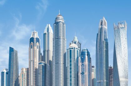 Successful real estate investors in Dubai celebrating profitable property investments and high ROI