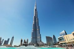 A scenic view of waterfront properties in Dubai, including luxury homes and beachfront developments