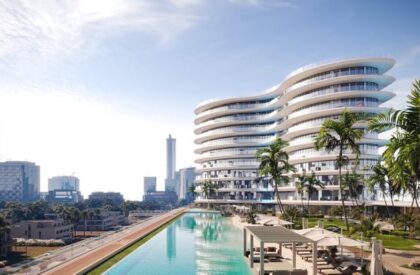 A panoramic view of Dubai's skyline, highlighting iconic buildings and real estate developments in 2025