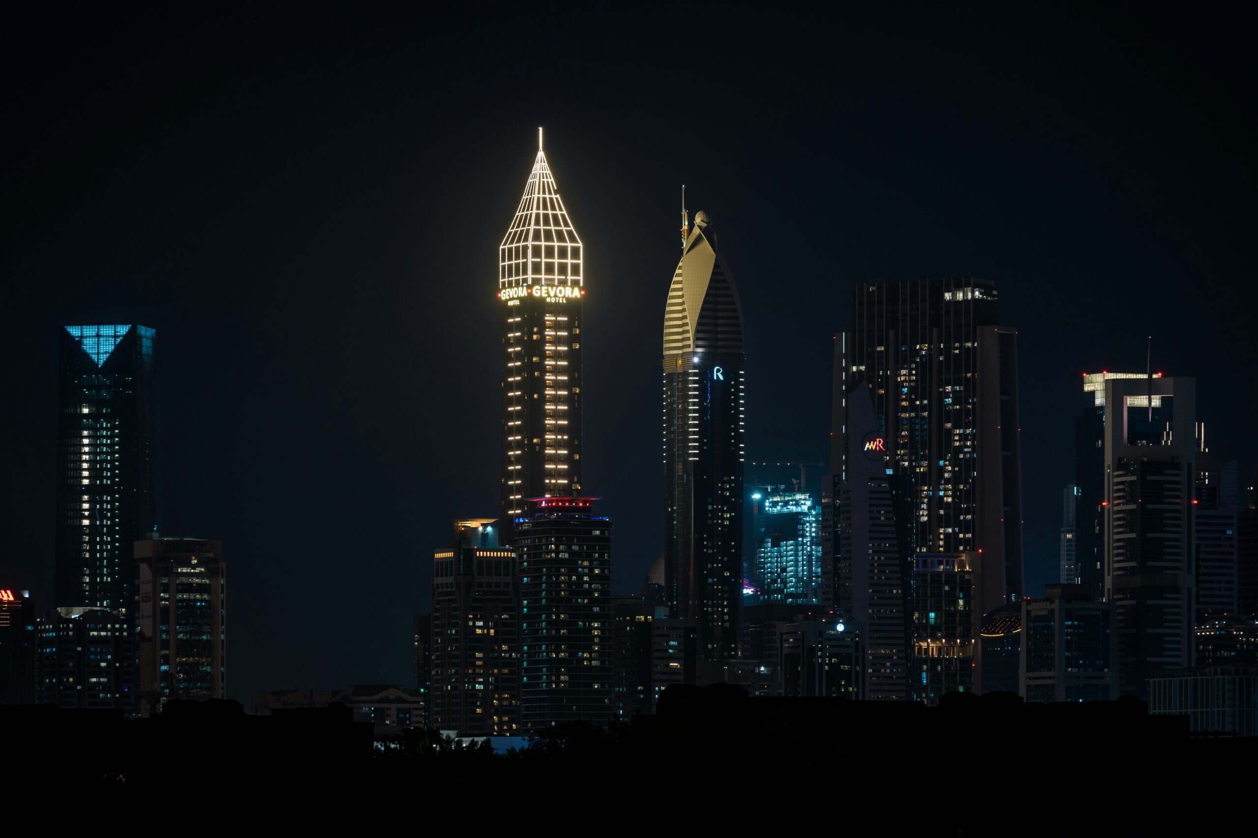 A real estate agent guiding a client through luxury property options in Dubai, showcasing the role of agents in the Dubai real estate market.
