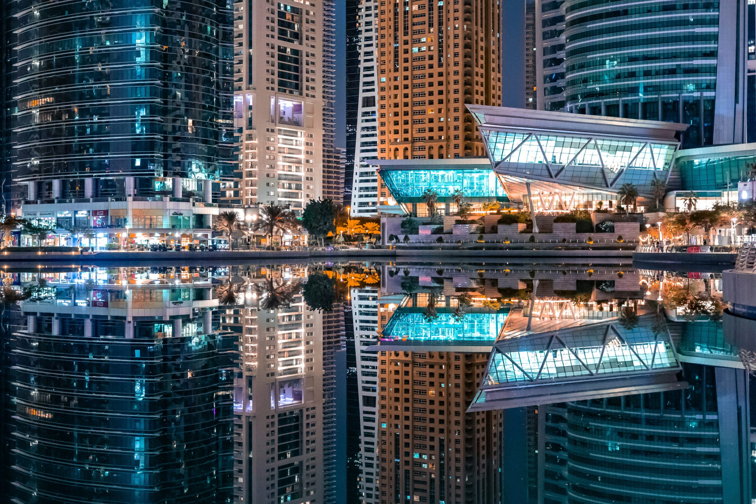 Aerial view of Dubai’s luxury neighborhoods including Palm Jumeirah, Downtown Dubai, and Emirates Hills, showcasing upscale living environments.
