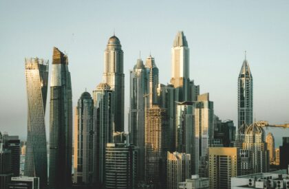 Technology in Dubai Real Estate – Smart Tools Transforming the Property Market Real estate agent using technology like virtual tours and smart property dashboards to manage Dubai real estate transactions.